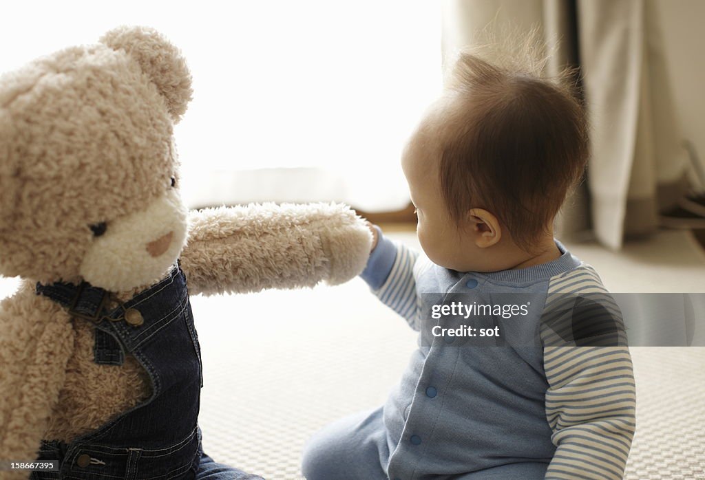 Baby boy with teddy bear