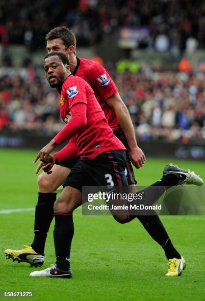 Patrice Evra of Manchester United celebrates his goal during the Barclays Premier League match between Swansea City and Manchester United at the...