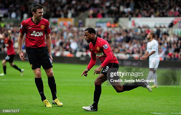 Patrice Evra of Manchester United celebrates his goal during the Barclays Premier League match between Swansea City and Manchester United at the...