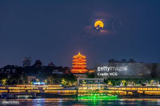 Super moon rises over Yellow Crane Tower on August 1, 2023 in Wuhan, Hubei Province of China.