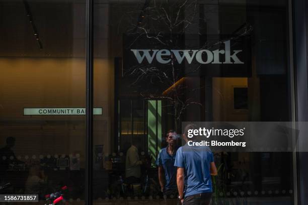 Logo near an entrance to a WeWork Inc. Co-working office near Waterloo railway station London, UK, on Wednesday, Aug. 9, 2023. The New York-based...