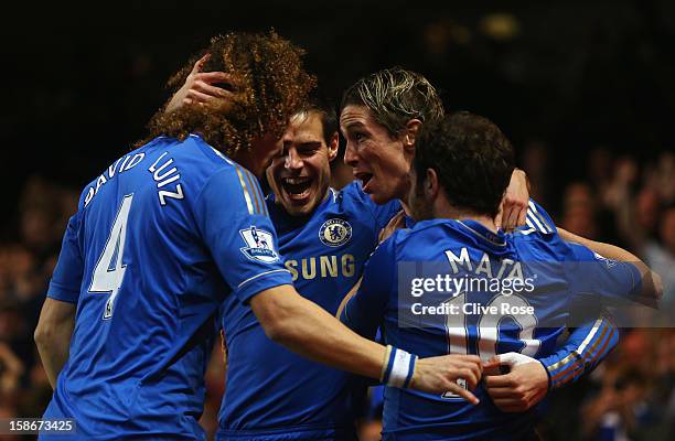 Fernando Torres of Chelsea celebrates with team mates as he scores their first goal during the Barclays Premier League match between Chelsea and...