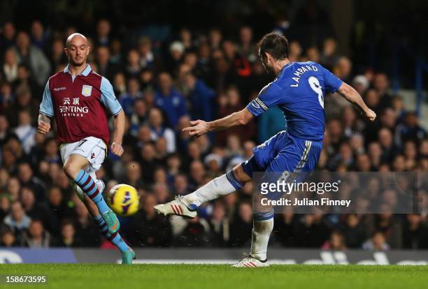 Frank Lampard of Chelsea scores their fourth on his 500th Premier League start during the Barclays Premier League match between Chelsea and Aston...