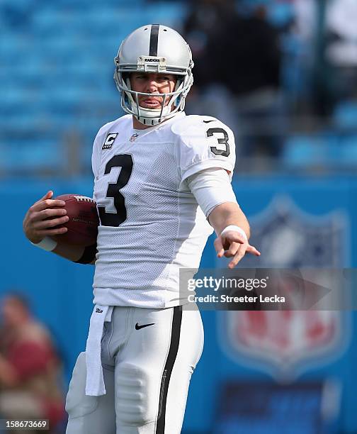 Carson Palmer of the Oakland Raiders warms up before their game against the Carolina Panthers at Bank of America Stadium on December 23, 2012 in...