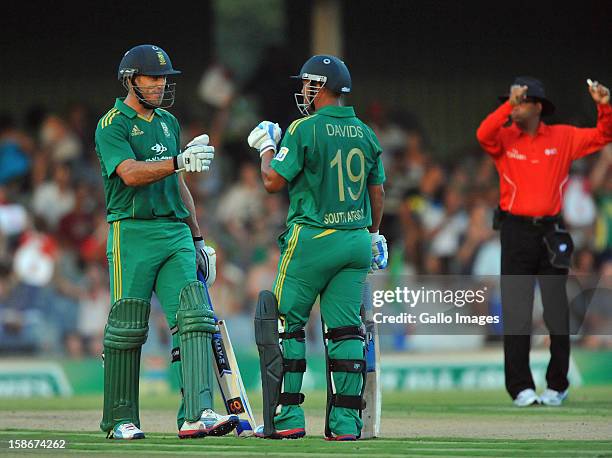 Faf du Plessis and Henry Davids celebrates a six during the 2nd T20 match between South Africa and New Zealand at Buffalo Park on December 23, 2012...