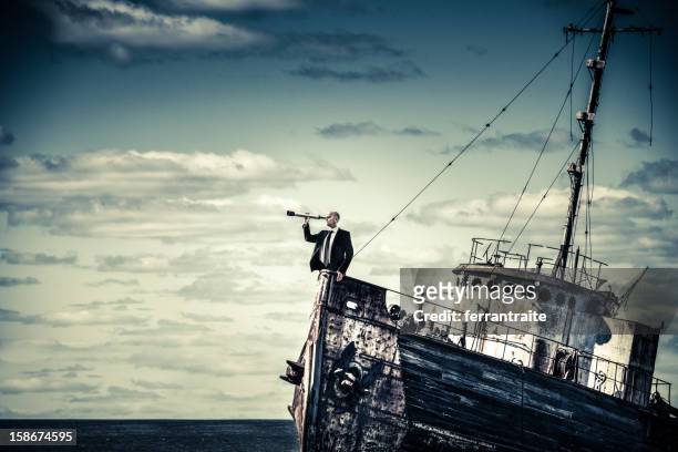 overcome the economic crisis - team captain stock pictures, royalty-free photos & images