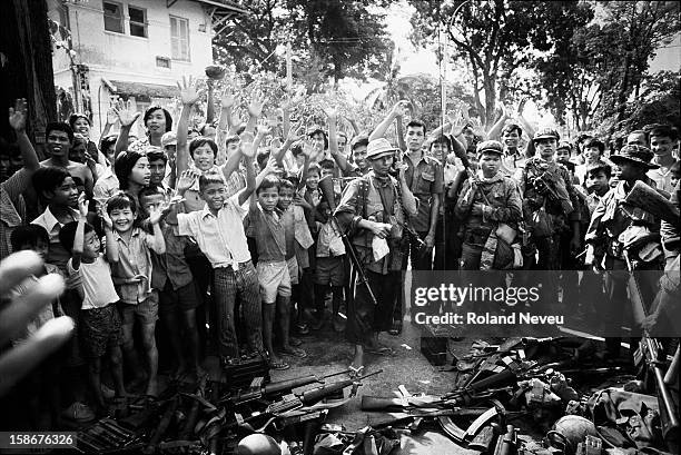 The Fall of Phnom Penh to the Khmer Rouge on April 17, 1975. As the Khmer Rouge guerrilla are entering the city, call are made to collect and put in...