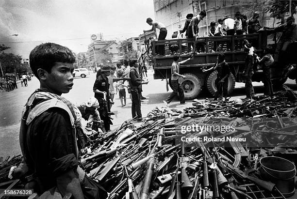 The Fall of Phnom Penh to the Khmer Rouge on April 17, 1975. As the Khmer Rouge guerrilla are entering the city, call are made to collect and put in...