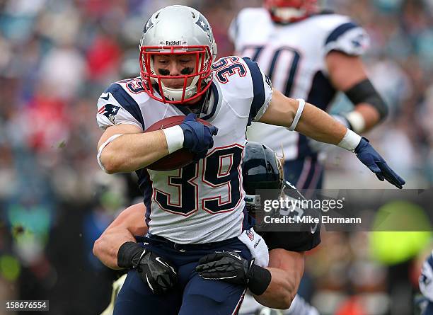 Danny Woodhead of the New England Patriots is tackled by Paul Posluszny of the Jacksonville Jaguars during a game at EverBank Field on December 23,...