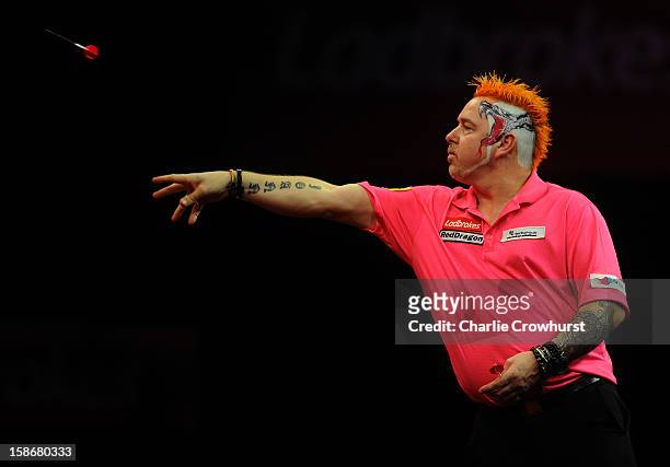 Peter Wright of England in action during his second round match against Michael van Gerwen of the Netherlands on day Ten of the Ladbrokes.com World...