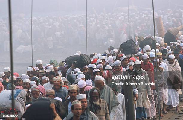 Crowd of Muslims leave the venue of the Biswa Ijtema on the Turag River. This gathering, the second biggest in the world, attracts millions of...