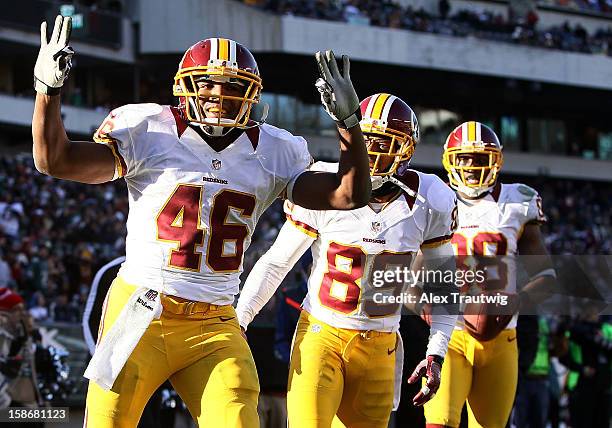 Alfred Morris of the Washington Redskins celebrates a touchdown with teammates Santana Moss and Pierre Garcon at Lincoln Financial Field on December...