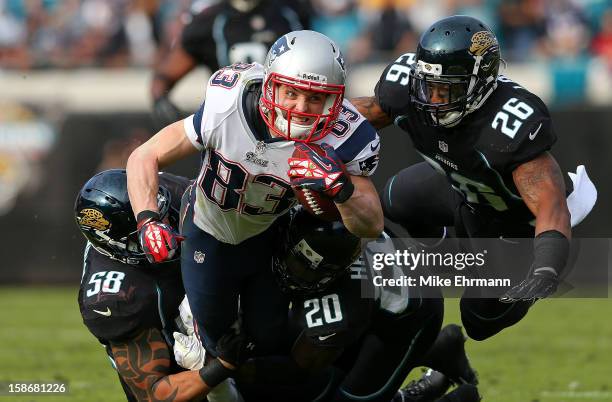 Wes Welker of the New England Patriots dives after a catch during a game against the Jacksonville Jaguars at EverBank Field on December 23, 2012 in...