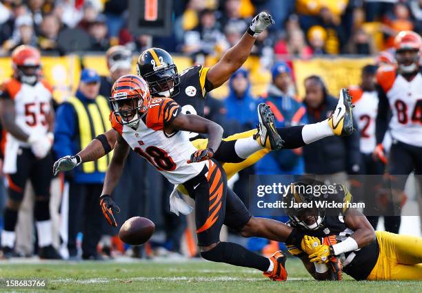 Green of the Cincinnati Bengals fumbles the ball after having it knocked out of his hands by James Harrison of the Pittsburgh Steelers during the...