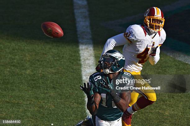 Jeremy Maclin of the Philadelphia Eagles catches a pass for a touchdown in front of Madieu Williams of the Washington Redskins at Lincoln Financial...