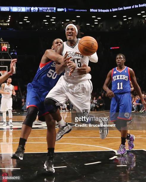 Gerald Wallace of the Brooklyn Nets is tripped up in the game against the Philadelphia 76ers at Barclays Center on December 23, 2012 in the Brooklyn...
