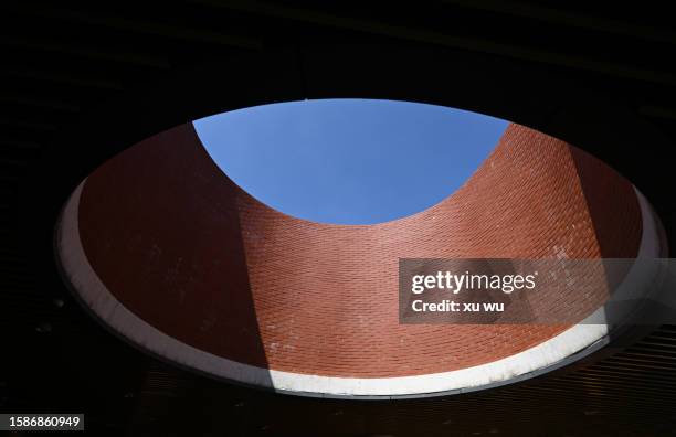 Red Rounded Buildings Round Window Building Photos and Premium High Res Pictures - Getty Images