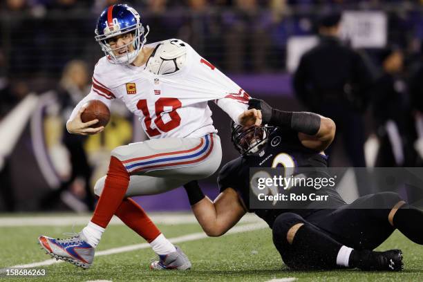 Defensive end Haloti Ngata of the Baltimore Ravens sacks quarterback Eli Manning of the New York Giants during the second quarter at M&T Bank Stadium...