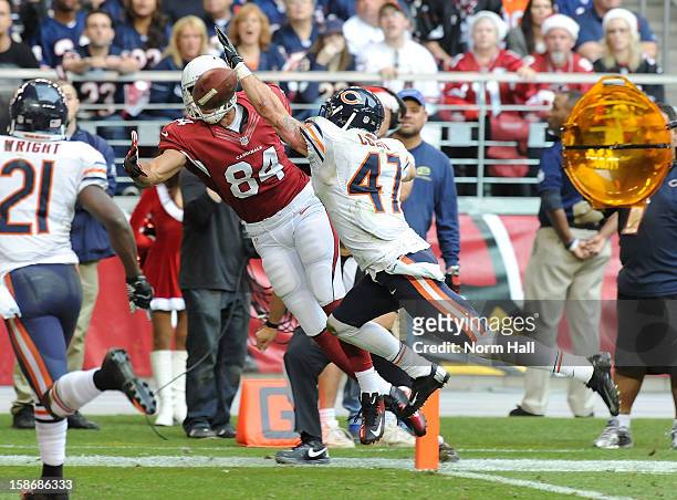 Rob Housler of the Arizona Cardinals attempts to make a catch while being defended by Chris Conte of the Chicago Bears at University of Phoenix...