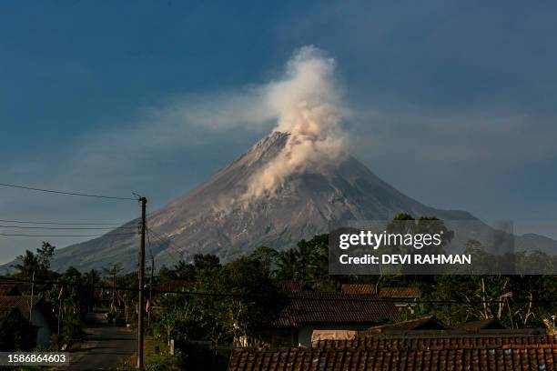 Mount Merapi spews smoke during an effusive eruption as seen from Wonokerto village, Yogyakarta, on August 9, 2023.