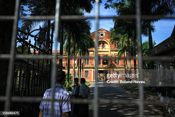 The grand reddish front gate of the former Minister's Building in Yangon. This was the former Secretariat building, home of the the administration of...