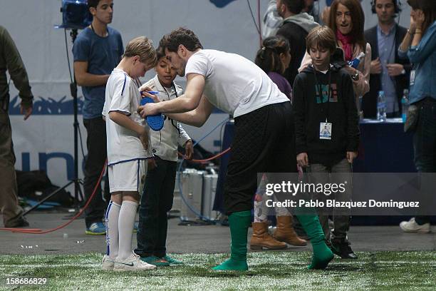 Iker Casillas signs autographs after 'Partido X La Ilusion' by Iker Casillas Foundation at Palacio de los Deportes on December 23, 2012 in Madrid,...