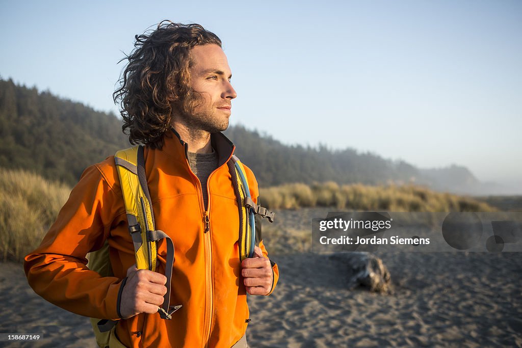 Man hiking near the ocean.
