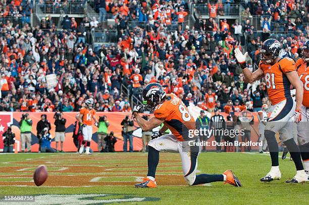 Wide receiver Eric Decker of the Denver Broncos celebrates a touchdown reception against the Cleveland Browns during a game at Sports Authority Field...