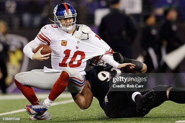Defensive end Haloti Ngata of the Baltimore Ravens sacks quarterback Eli Manning of the New York Giants during the second quarter at M&T Bank Stadium...