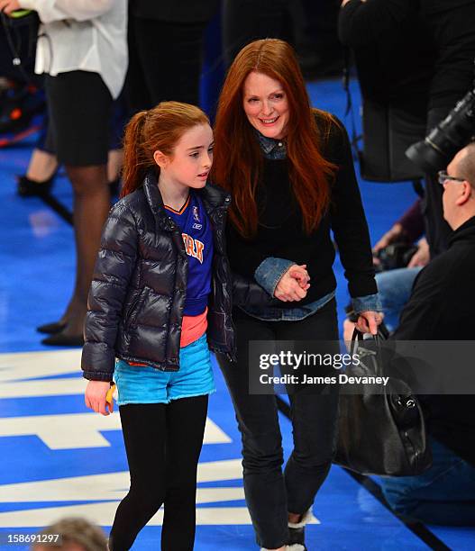Liv Helen Freundlich and Julianne Moore attend the Minnesota Timberwolves vs New York Knicks game at Madison Square Garden on December 23, 2012 in...