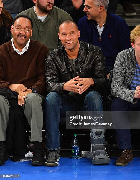 Derek Jeter and father, Sanderson Jeter attend the Minnesota Timberwolves vs New York Knicks game at Madison Square Garden on December 23, 2012 in...