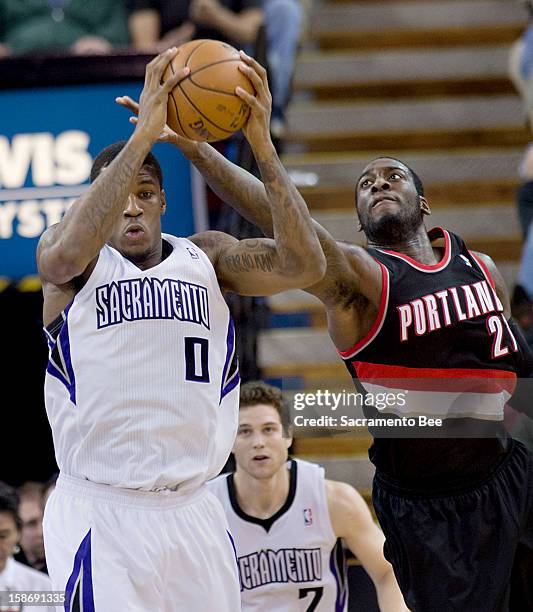 Sacramento Kings power forward Thomas Robinson pulls down a rebound against Portland Trail Blazers center J.J. Hickson during an NBA game at Sleep...