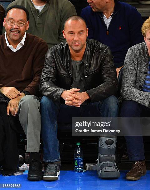 Derek Jeter and father Sanderson Jeter attend the Minnesota Timberwolves vs New York Knicks game at Madison Square Garden on December 23, 2012 in New...