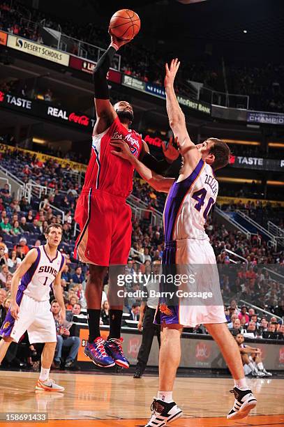 Ronny Turiaf of the Los Angeles Clippers shoots over Luke Zeller of the Phoenix Suns on December 23, 2012 at U.S. Airways Center in Phoenix, Arizona....
