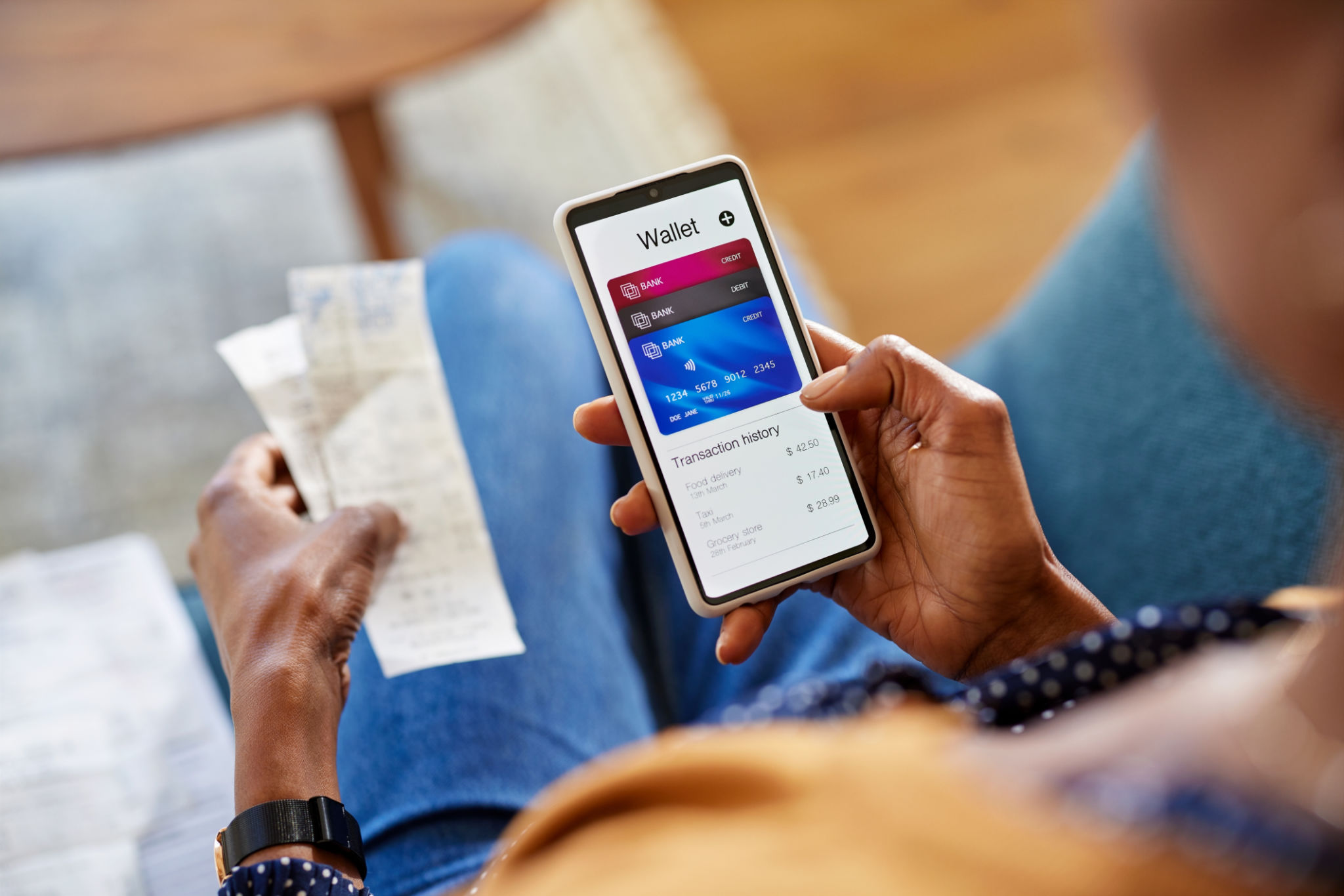 Black woman checking digital wallet on smartphone Black woman checking digital wallet on smartphone