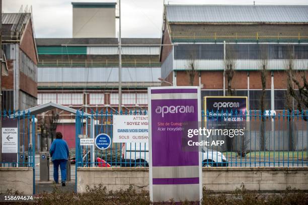 Person enters Aperam stainless steel factory, controlled by the Mittal family, on December 24, 2012 in Gueugnon, central France, where a fire broke...