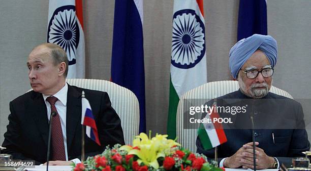 Russian President Vladimir Putin and Indian Prime Minister Manmohan Singh jointly address the media after a meeting in New Delhi on December 24,...