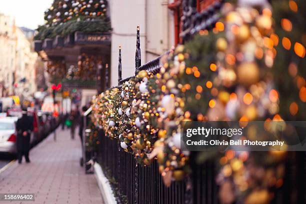 christmas lights outside claridges in london - mayfair london stock pictures, royalty-free photos & images