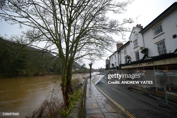 Flood barriers protect properties alongside the swollen River Severn at Ironbridge near Telford in Shropshire on December 24, 2012. Heavy flooding...