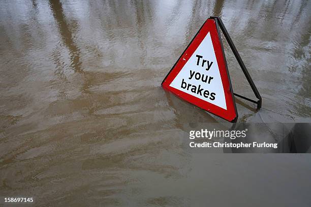 Road is flooded as the River Avon breaks its banks on December 24, 2012 in Upavon, England. Forecasters have predicted more rain to sweep across the...