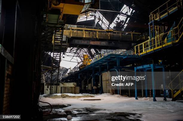 View of the damage at Aperam stainless steel factory, controlled by the Mittal family, on December 24, 2012 in Gueugnon, central France, after a fire...