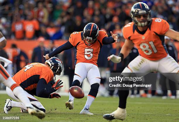 Place kicker Matt Prater of the Denver Broncos kicks a field goal from the hold of punter Britton Colquitt of the Denver Broncos as tight end Joel...