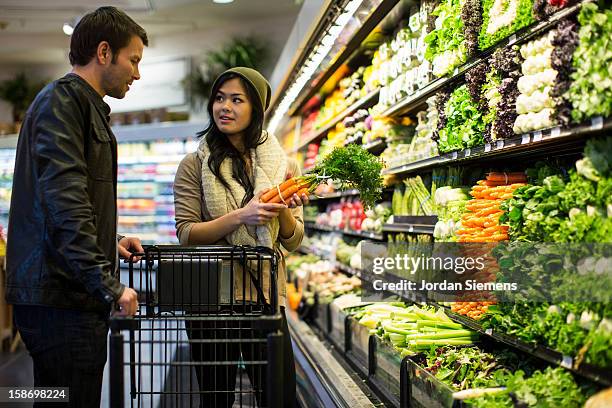 coupe shopping for groceries. - greengrocer's shop stock pictures, royalty-free photos & images