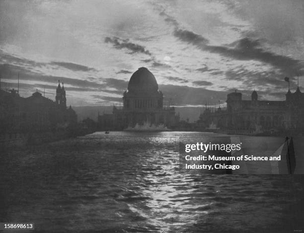 The White City, as viewed at midnight with a full moon in the background, at the World's Columbian Exposition in Chicago, Illinois, 1893. This image...