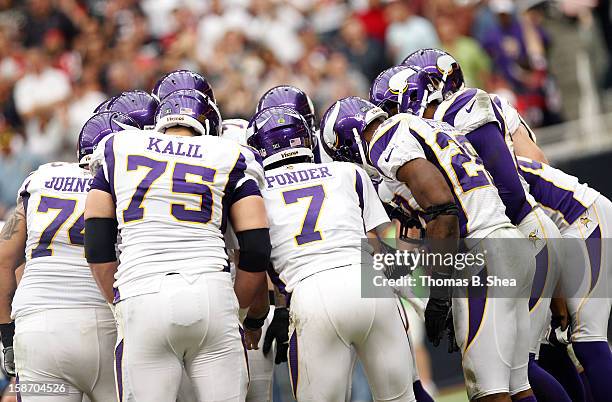 Christian Ponder of the Minnesota Vikings huddles against the Houston Texans on December 23, 2012 at Reliant Stadium in Houston, Texas.