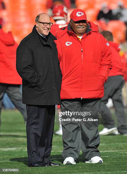 General Manager Scott Pioli talks with head coach Romeo Crennel of the Kansas City Chiefs before a game against the Indianapolis Colts on December...