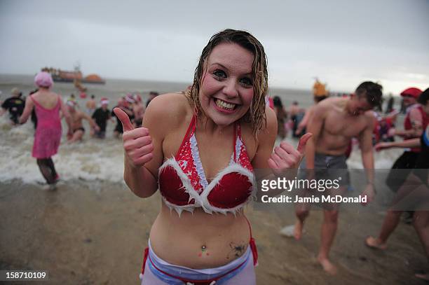 Hundreds of people brave the North Sea to raise money for charity during the annual Christmas Day dip at Lowestoft Beach on December 25, 2012 in...