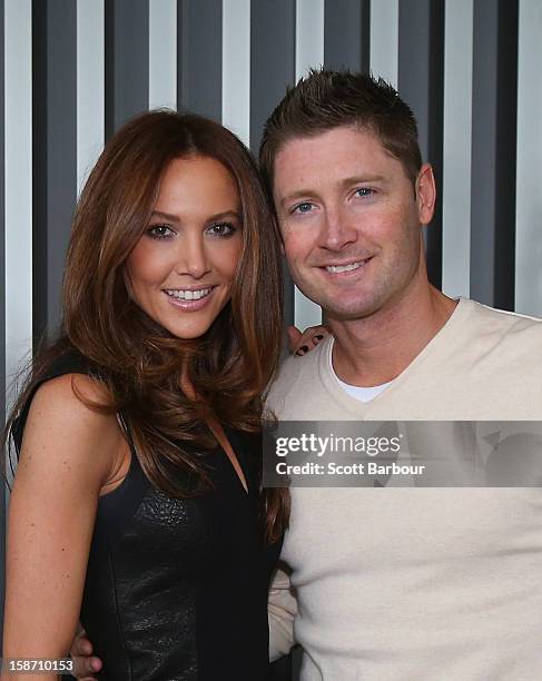 Michael Clarke of Australia and his wife Kyly Clarke pose next to a Christmas tree ahead of a Cricket Australia Christmas Day lunch at Crown...