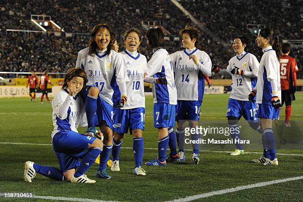 Yuki Ogimi celebrates with team-mates after scoring a goal during the Great East Japan Earthquake charity match 'SAWA and Friends, X'mas Night 2012'...
