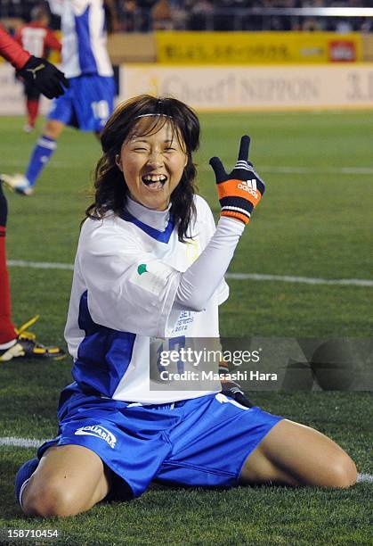 Yuki Ogimi celebrates after scoring a goal during the Great East Japan Earthquake charity match 'SAWA and Friends, X'mas Night 2012' at the National...